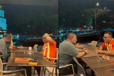 Tangkap layar video memaparkan Amirudin dan Sanusi melepak di sebuah restoran.