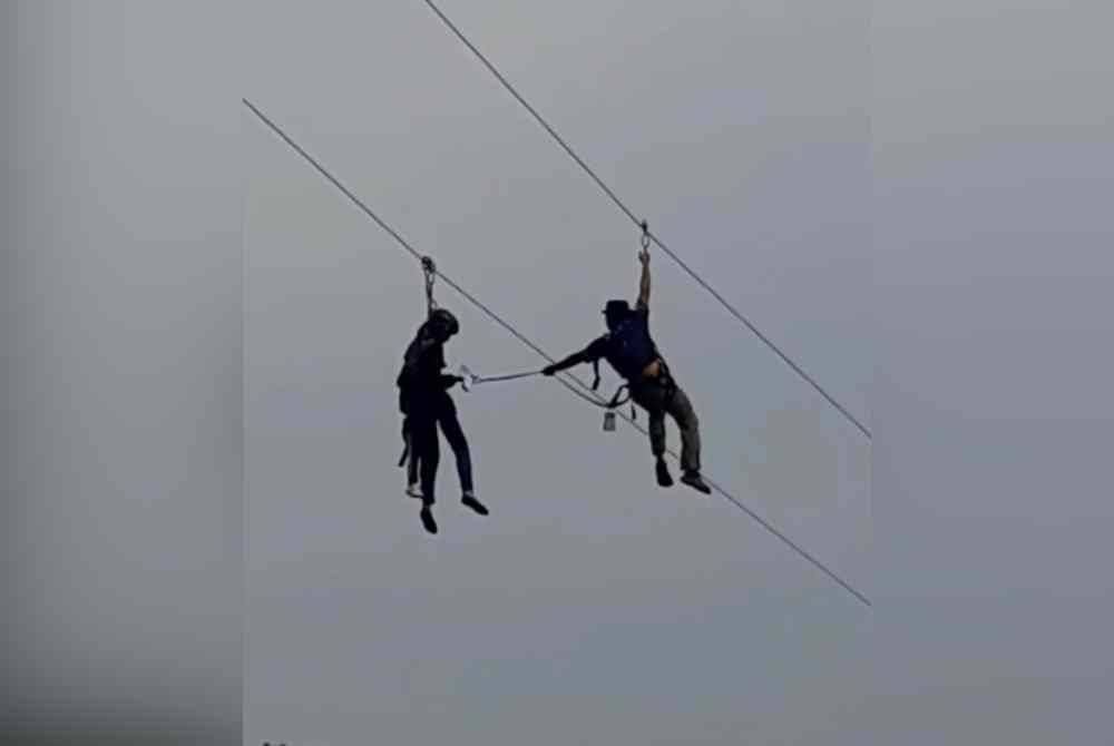 Video tular papar usaha menyelamat dua beranak tersangkut ketika menjalankan aktiviti flying fox di Taman Tasik Shah Alam.