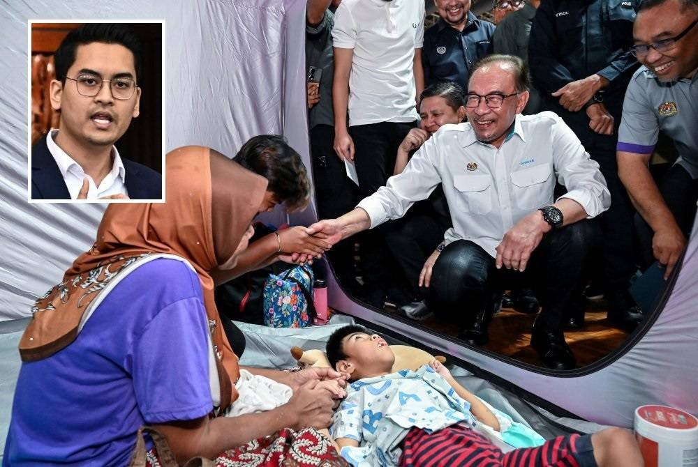 Anwar menyantuni Mohamad Afiq Ramadan, 9, yang terlantar akibat sawan sejak lahir ketika melawat mangsa banjir yang ditempatkan di pusat pemindahan sementara (PPS) Stadium Suka Menanti hari ini. Foto Bernama (Gambar kecil: Dr Taufiq Johari)