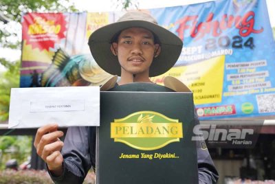 Mohd Helmi dinobatkan juara pertandingan memancing 'Fun Fishing' sempena MAHA 2024. Foto Rosli Talib - SINAR HARIAN