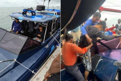 Mangsa (kanan) dibawa oleh pasukan PPM ke Jeti Penumpang Maritim Lumut untuk mendapatkan rawatan. Foto ihsan Maritim Malaysia.