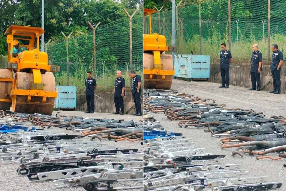 Fisol (kiri) melihat proses pelupusan dilakukan di Ibu Pejabat Polis Daerah Kuala Muda pada Selasa.