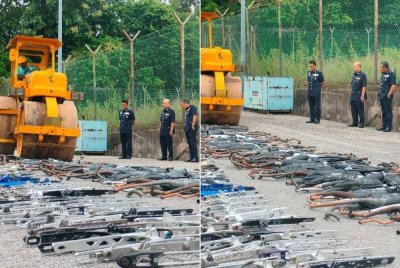 Fisol (kiri) melihat proses pelupusan dilakukan di Ibu Pejabat Polis Daerah Kuala Muda pada Selasa.