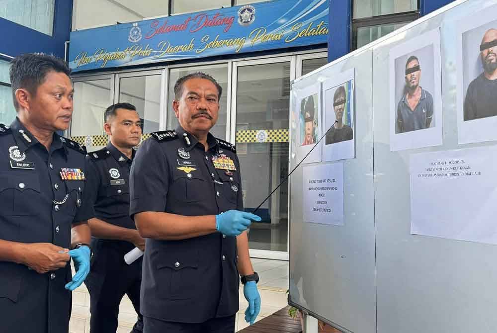 Hamzah menunjukkan gambar dua suspek warga asing yang ditembak mati.