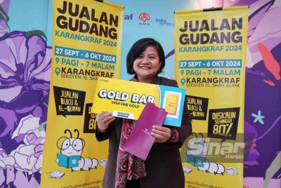 Masria teruja membawa pulang satu gram emas 999. Foto Sinar Harian/ MOHD HALIM ABDUL WAHID.