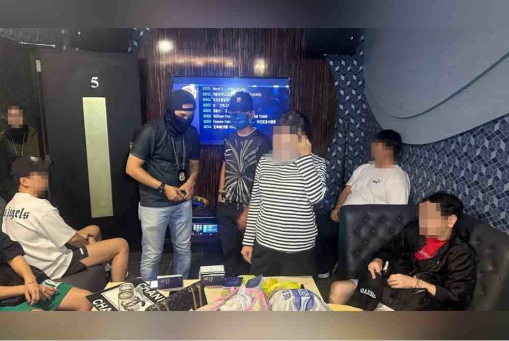 JIM Kuala Lumpur menjalankan pemeriksaan ke atas individu yang ditahan dalam serbuan Op Gegar di Solaris, Kuala Lumpur pada Jumaat.