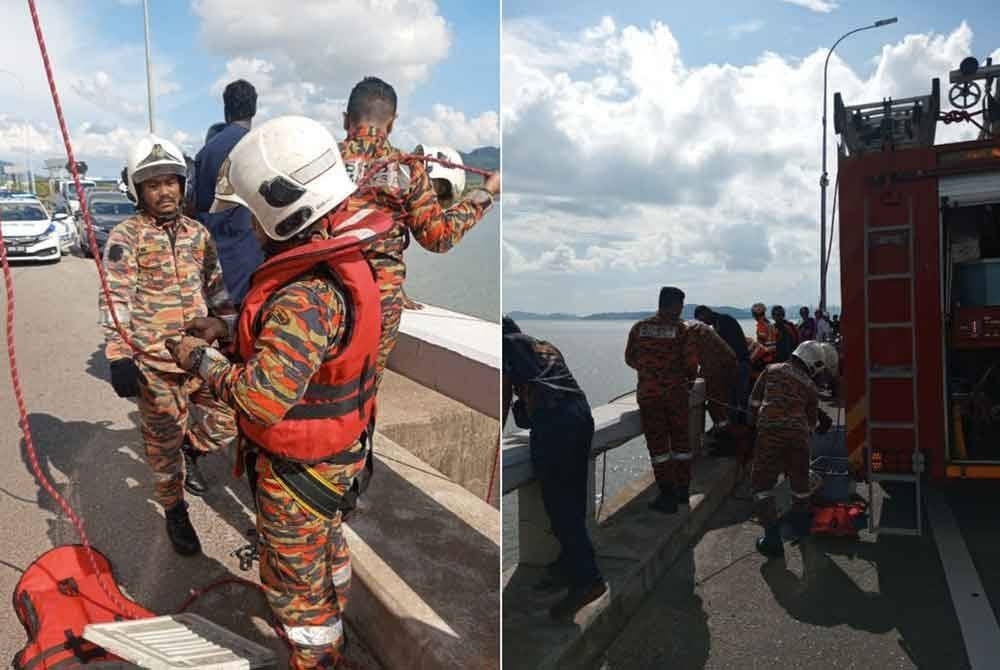 Anggota bomba melakukan kerja-kerja menyelamatkan wanita yang terjatuh dari Jambatan Pulau Pinang.