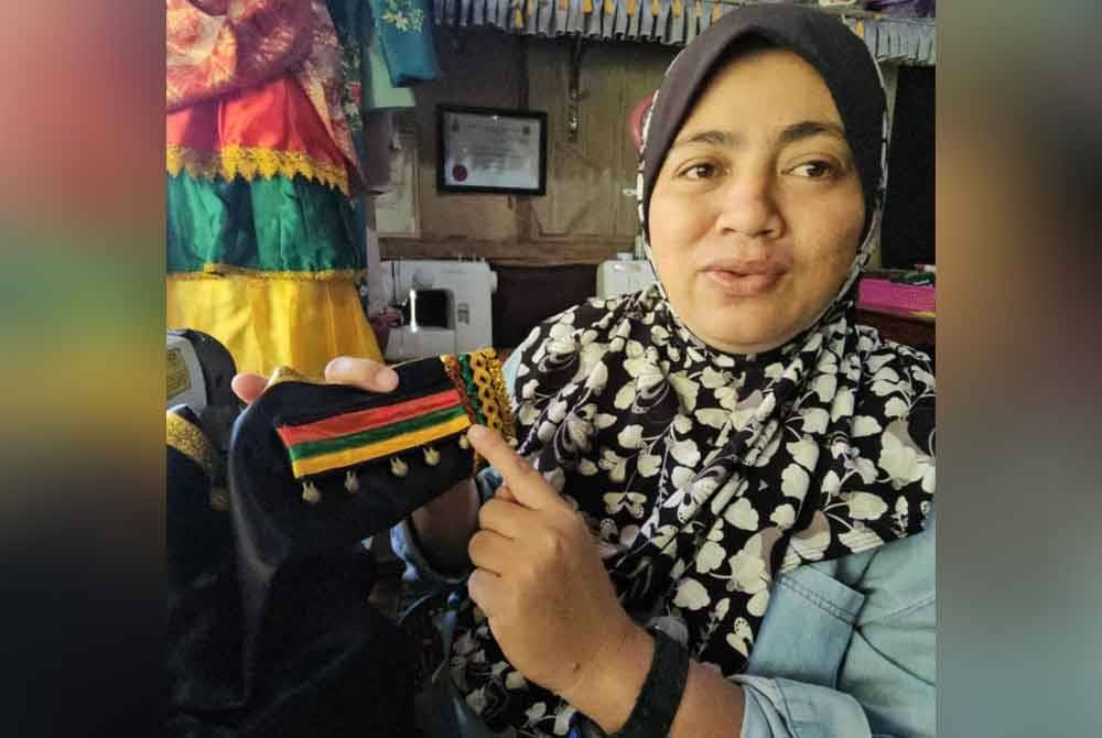 Roslinah mengekalkan ciri tradisi seperti warna dan aksesori dalam rekaan kontemporari pakaian tradisi Bisaya.