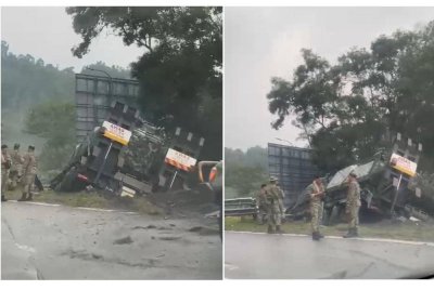 Sebuah lori pengangkut ATM yang membawa kenderaan perisai terbabas di Kilometer 35.2 dari Genting Sempah ke Gombak, Selangor pada Khamis.