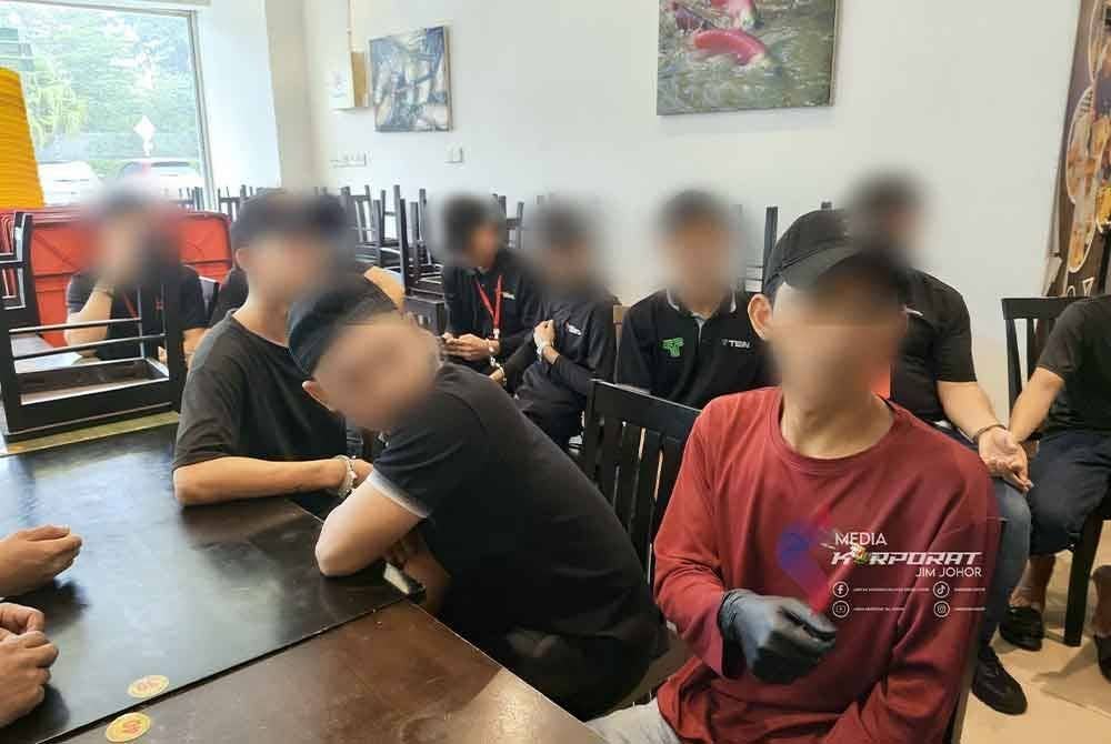 Sebahagian warga asing yang ditahan dalam serbuan berkenaan. - Foto JIM Johor