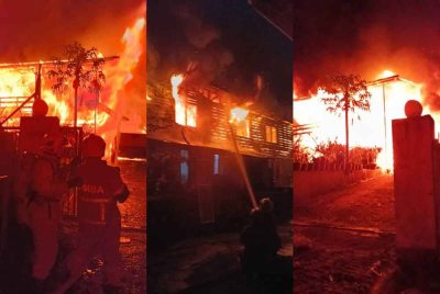 Kebakaran melibatkan dua rumah di Kampung Muhibbah di sini pada awal pagi Jumaat. Foto ihsan JBPM