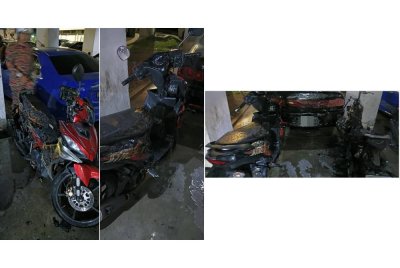 Keadaan motosikal dan kereta terbakar di kawasan parkir Projek Perumahan Rakyat (PPR) Pantai Ria, di sini, pada Selasa.