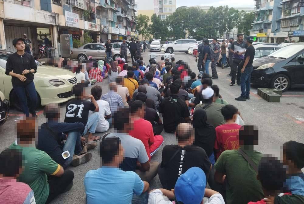 Antara warga asing yang diperiksa dalam operasi bersepadu di Flat Pandan Mewah.