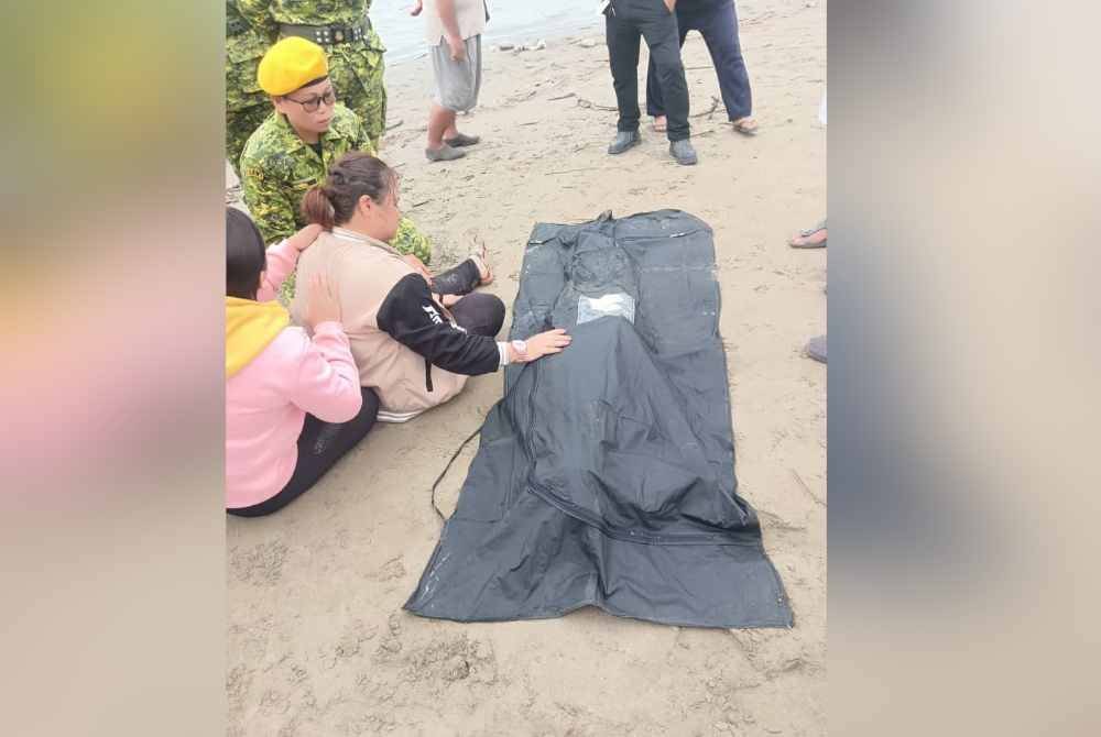 Ahli keluarga berada di lokasi selepas mayat ditemukan di Sungai Kadamaian, Kampung Piasau, Kota Belud.