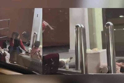 Tangkap layar rakaman video Nur'ain mengenai ibu lima anak berniaga di kaki lima bank yang tular.