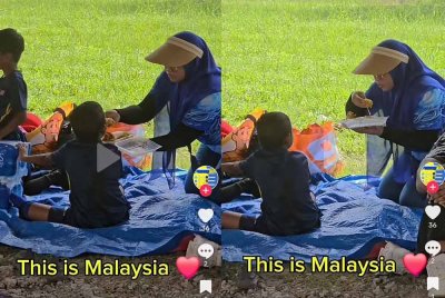 Guru menyuapkan makanan kepada anak murid India raih pujian.