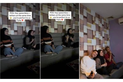 Nur Syafiqah (kanan) ketika sedang melakukan bahasa isyarat sewaktu sedang berkaraoke bersama rakannya.