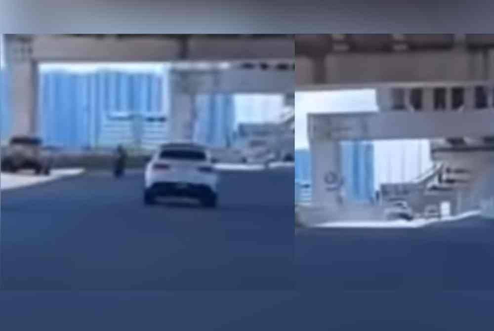 Video tular memaparkan kemalangan penunggang motosikal dan sebuah kereta.