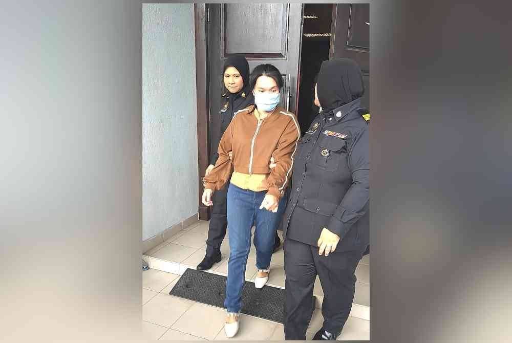 Yin Ying diiring pegawai KPDN ketika hadir ke Mahkamah Sesyen di Seremban pada Rabu.