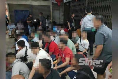 Sebahagian PATI ditahan petugas JIM menerusi 'KL Strike Force' di Jalan Petaling, Kuala Lumpur pada Jumaat.