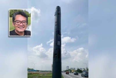 Kamera AWAS dipasang di tepi jalan menyerupai tiang besi biasa. Gambar kecil: Hezeri Samsuri