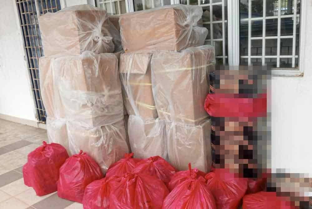 Minuman keras dan rokok tidak bercukai yang dirampas di Taman Cendana, Pasir Gudang pada Isnin. - FOTO: IPD Seri Alam