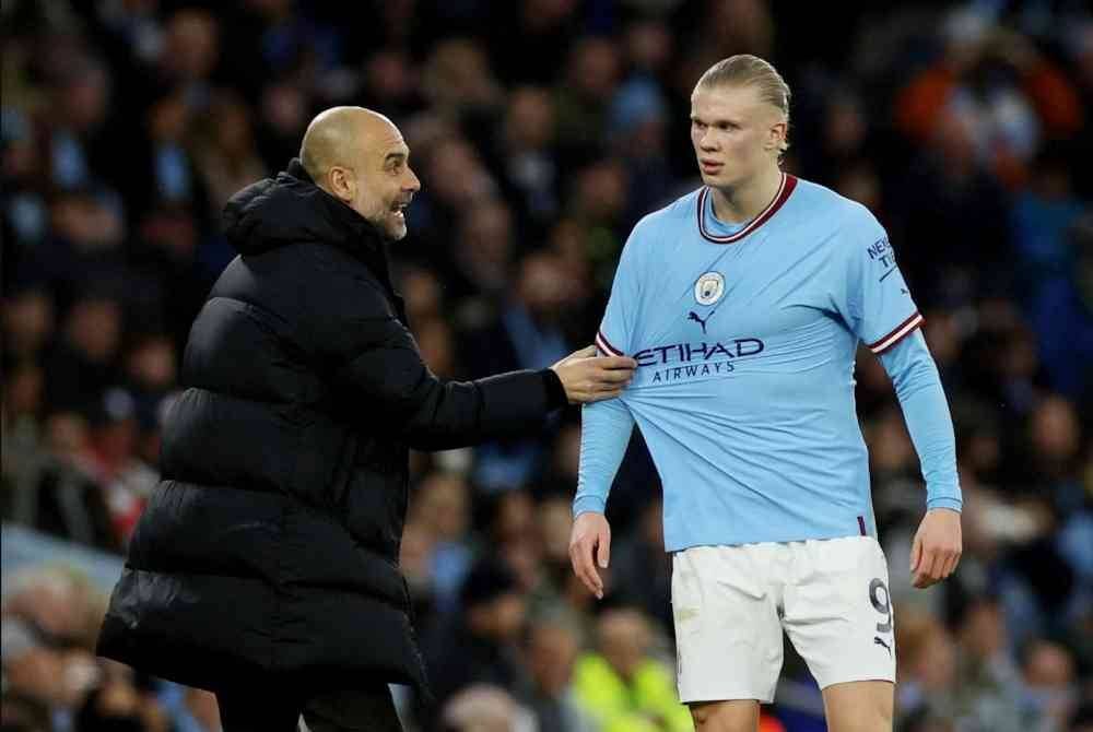 Haaland (kanan) akui selesa bekerja bersama Guardiola. Foto Agensi
