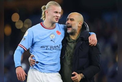 Haaland (kiri) dan Guardiola.