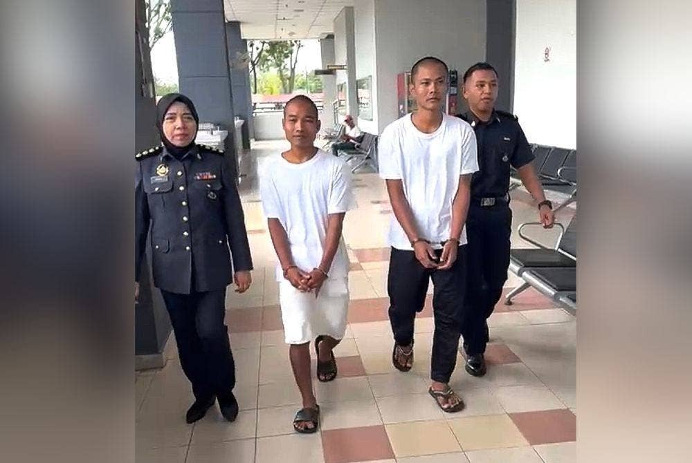 Sein Kyi Moe (kanan, tinggi) dan Tun Tun Kyaing dipenjara enam bulan atas pertuduhan menyimpan LPG tanpa lesen.