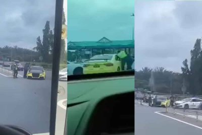 Tangkap layar video tular memaparkan anggota polis menghampiri kereta berwarna kuning berhampiran Plaza Tol Yong Peng Utara pada Isnin.