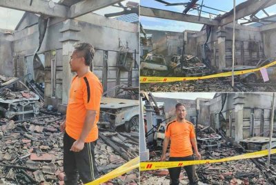 Abdul Razak dan keluarganya tinggal sehelai sepinggang selepas rumah mereka di Taman Tunku Sarina di sini musnah dalam kebakaran tengah hari tadi. Foto Bernama