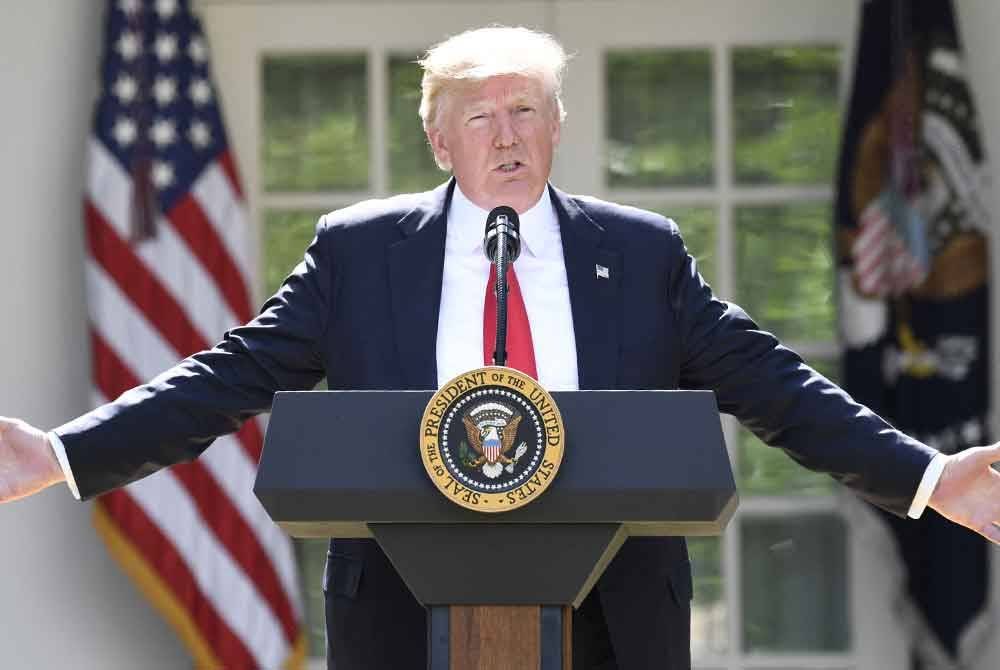 Kebangkitan Trump dan slogannya ‘Agungkan AS sekali lagi’ (Make America Great Again - MAGA) berlatarkan dua perkembangan. Foto AFP