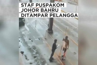 Tangkap layar video tular kejadian seorang lelaki menampar kakitangan Puspakom di Johor Bahru.