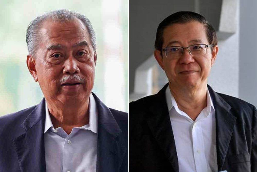 Muhyiddin (kiri), Guan Eng (kanan).