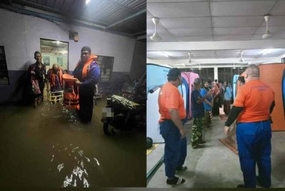 Anggota APM menyelamatkan mangsa banjir. Foto APM Taiping