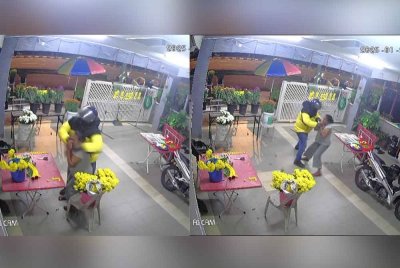 Tangkap layar video tular suspek yang berpura-pura menjadi pelanggan sebelum meragut rantai emas mangsa di Teluk Intan. Foto ihsan pembaca