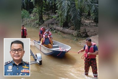 Anggota bomba dikerah membantu mangsa banjir di negeri ini. Gambar kecil: Zainal