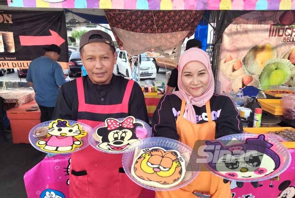 Nor Shahidah dan Mohd Fakhrul Azam bersama pankek yang dihasilkan.