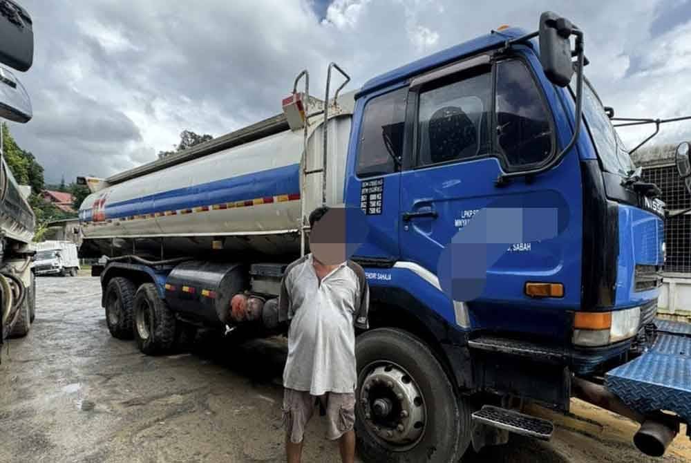 Antara individu yang ditahan bersama lori yang digunakan untuk aktiviti menyeleweng diesel di Kampung Bantayan, Inanam, Kota Kinabalu.
