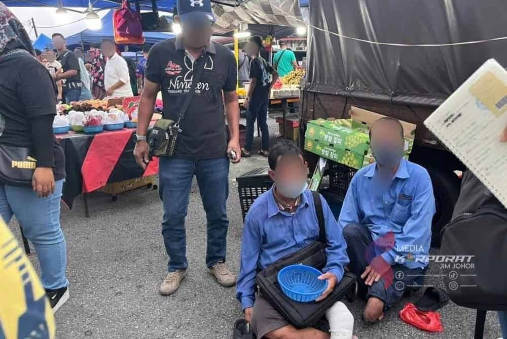 Dua daripada 18 pengemis warga asing yang ditahan dalam operasi pada Isnin. - Foto JIM Johor