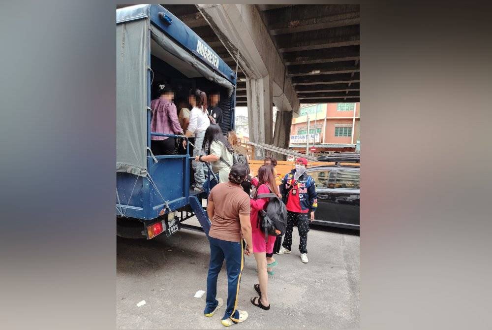 Antara yang ditahan dalam serbuan premis di Jalan Pudu, pada Rabu.