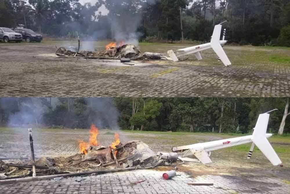 Keadaan bangkai helikopter yang musnah terbakar selepas terbalik ketika mendarat untuk mengisi bahan api di lokasi berhampiran kolam air panas, Jalan Lama Kuala Lumpur-Bentong pada Khamis.