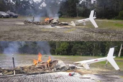 Keadaan bangkai helikopter yang musnah terbakar selepas terbalik ketika mendarat untuk mengisi bahan api di lokasi berhampiran kolam air panas, Jalan Lama Kuala Lumpur-Bentong pada Khamis.