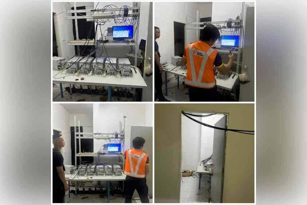 Anggota polis dan pasukan TNB Seal Team Selangor melakukan pemeriksaan di sebuah kediaman yang terbakar di Lorong Cekara Purnama, Bandar Puncak Alam, Sungai Buloh yang dijadikan lokasi kegiatan haram Bitcoin.Foto PDRM