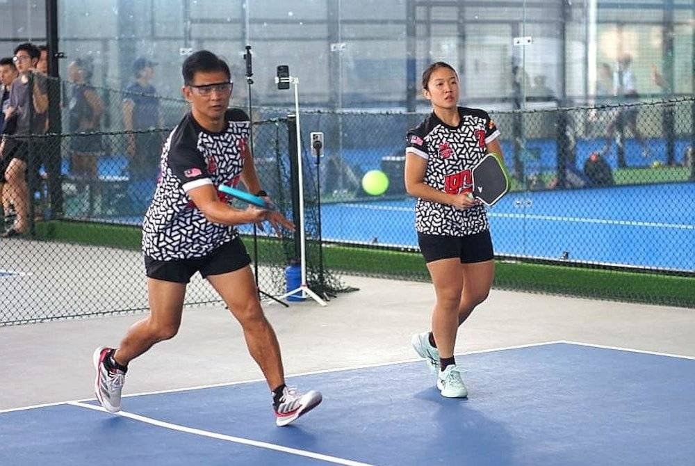 Mirnawan dan Ju En beraksi sebagai beregu campuran ASPAC. Foto SportsUnite