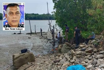 Anggota polis menjalankan siasatan di lokasi mayat mangsa ditemui pada Khamis.