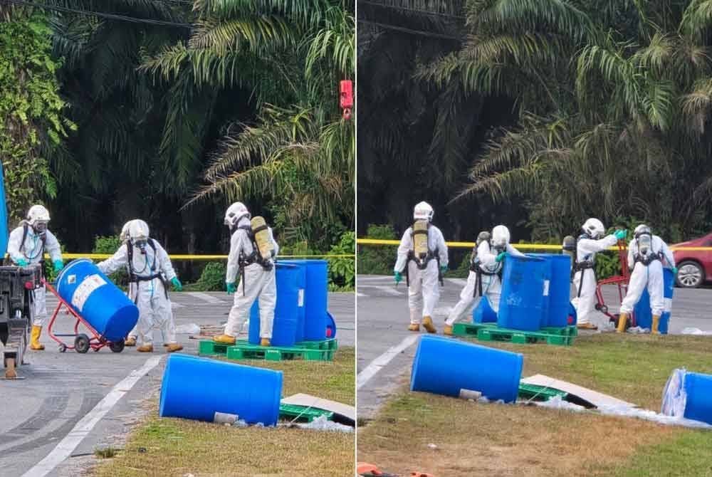 Anggota Hazmat memakai PPE lengkap sepanjang operasi mengalihkan tong kimia yang terbalik akibat kemalangan. Foto JBPM