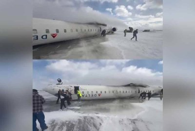 Pesawat Delta Airline terbalik selepas melakukan pendaratan cemas di Lapangan Terbang Toronto Pearson - Foto: Agensi