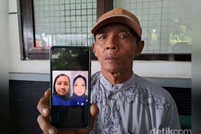 Musman menunjukkan gambar Putri, yang dilaporkan hilang sebelum ditemui mati terapung di dalam sungai.