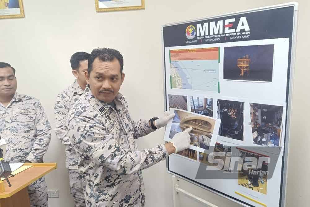 Mohd Khairulanuar menunjukkan gambar suspek bersembunyi di pelantar minyak.